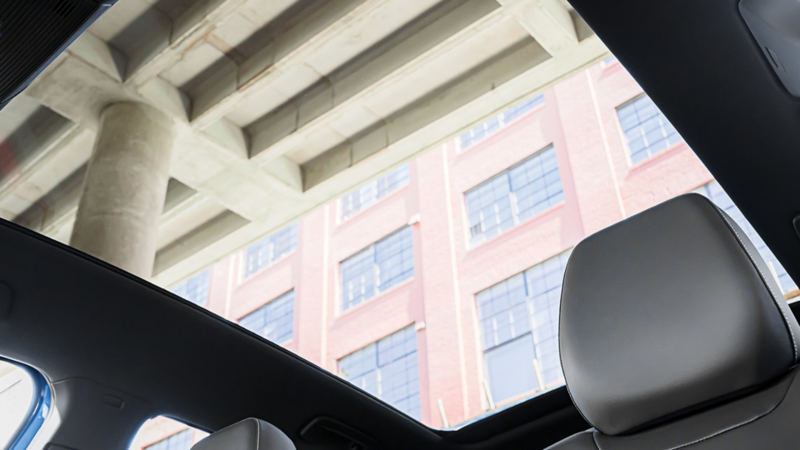 Interior image of a Mountain Lake Blue Metallic ID.4 showing the available panoramic sunroof
