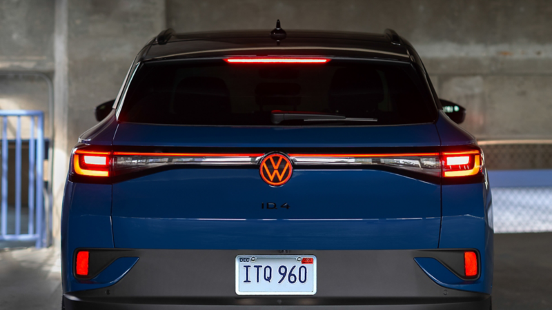 Back view of a ID.4 shown in Mountain Lake Blue Metallic parked in a industrial setting