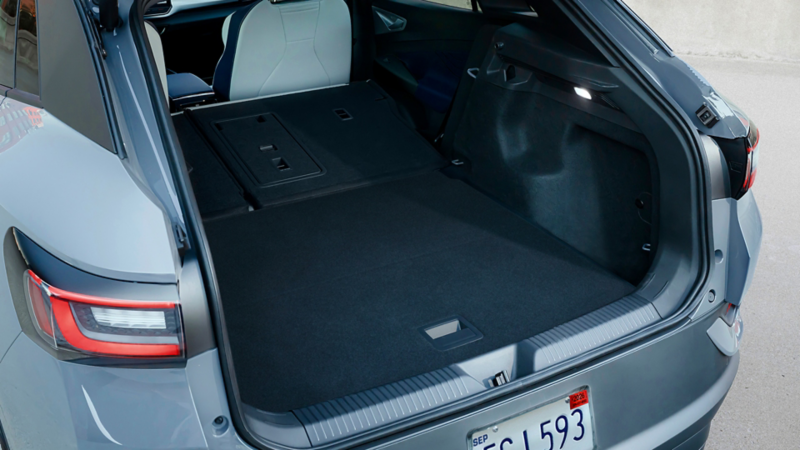 Pure Gray ID.4 showing off its cargo space with the second row folded down.
