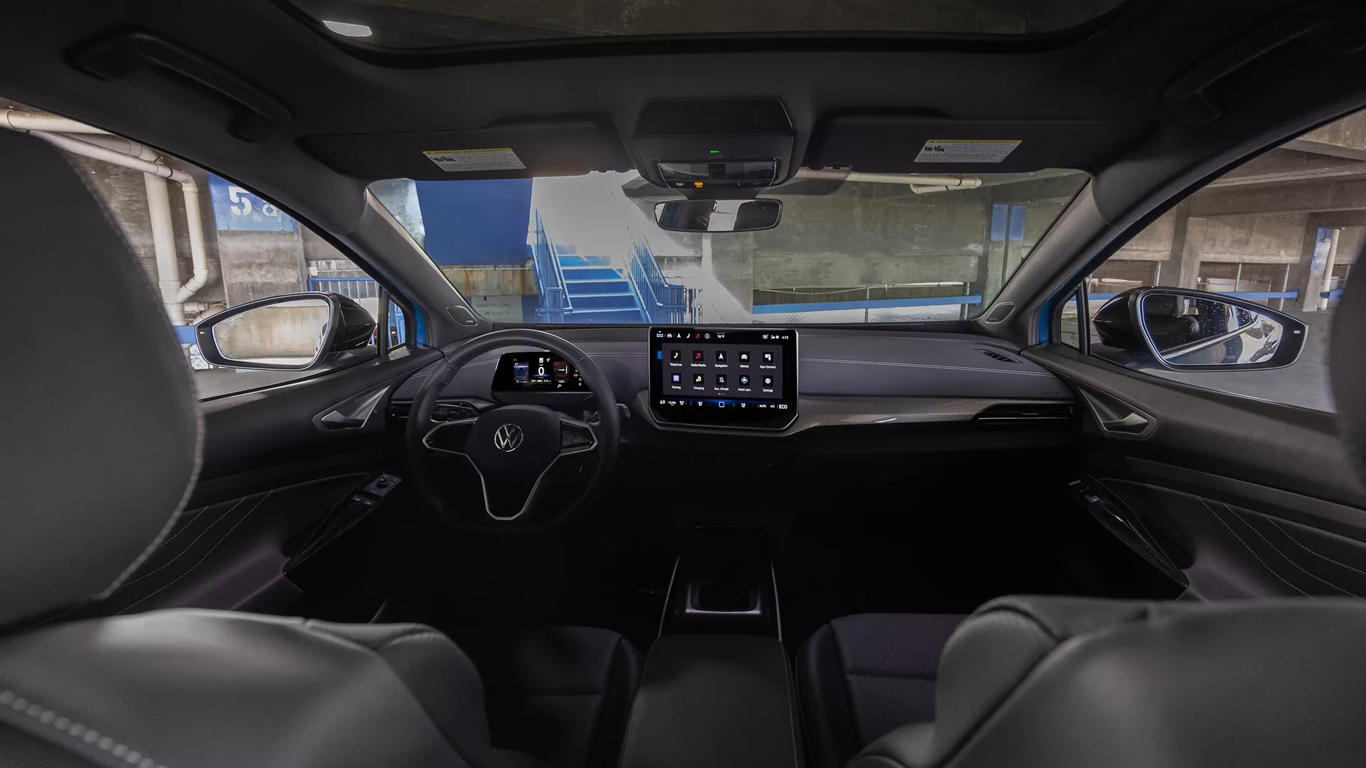 Volkswagen ID.4 interior with digital instrument cluster and central touchscreen