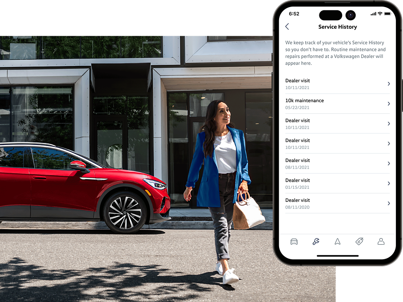 Street level shot of a woman walking away from a parked ID.4 SUV in Aurora Red Metallic. The MyVW app is displayed on a superimposed mobile phone.