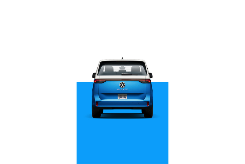 A rear view of the ID. Buzz in Cabana Blue Metallic in front of a two-tone white and blue. 