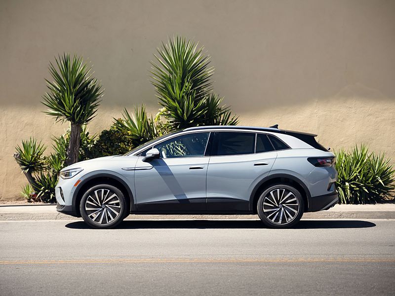 ID.4 AWD Pro S Plus shown in Arctic Blue Metallic parked near a sidewalk.