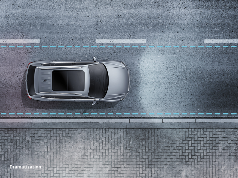 Glowing lines illustrate an invisible border within the lane of a highway.