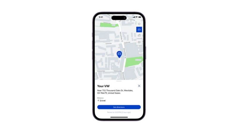 A smartphone showing the myVW app with last parked location information on the smartphone display.