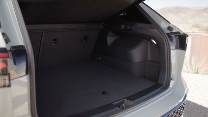 Rear view of a Tiguan with the liftgate open showing the cargo space inside.