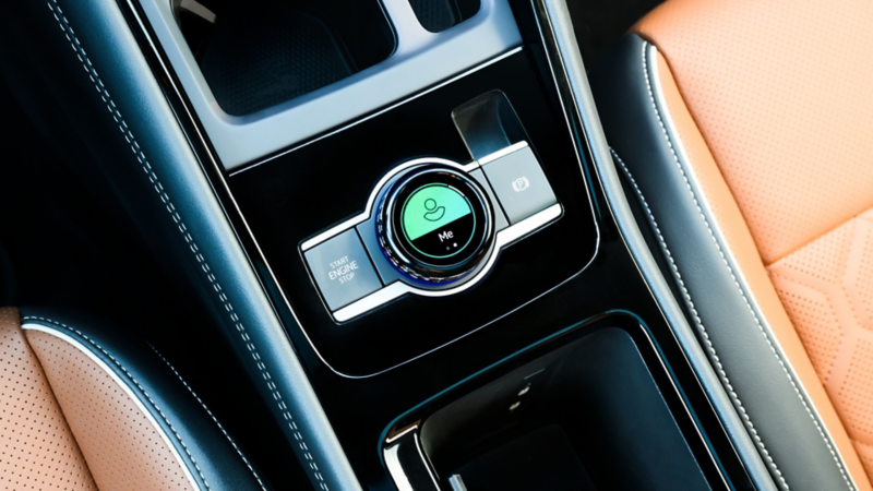 Close up view showing the available Driving Experience Dial in a Tiguan shown shown in available Amber Brown leather.