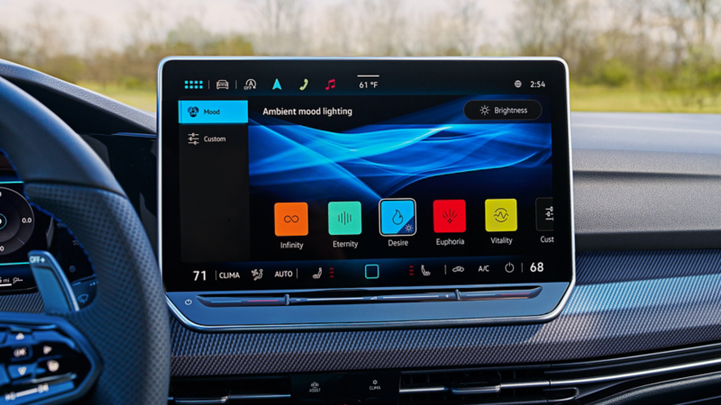 Close-up of the touchscreen display in the Golf R showing ambient mood lighting settings with selectable themes including Infinity, Eternity, Desire, Euphoria, and Vitality