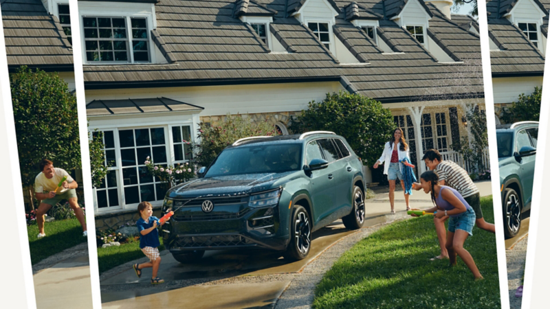 Front view of an Atlas shown in Sacramento Green Metallic parked in a driveway with a family playing outside in the front yard.