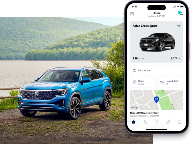Atlas Cross Sport shown in Kingfisher Blue Metallic parked in front of a lake with a forest in the background. To the right, the MyVW app interface is displayed on a compatible phone.