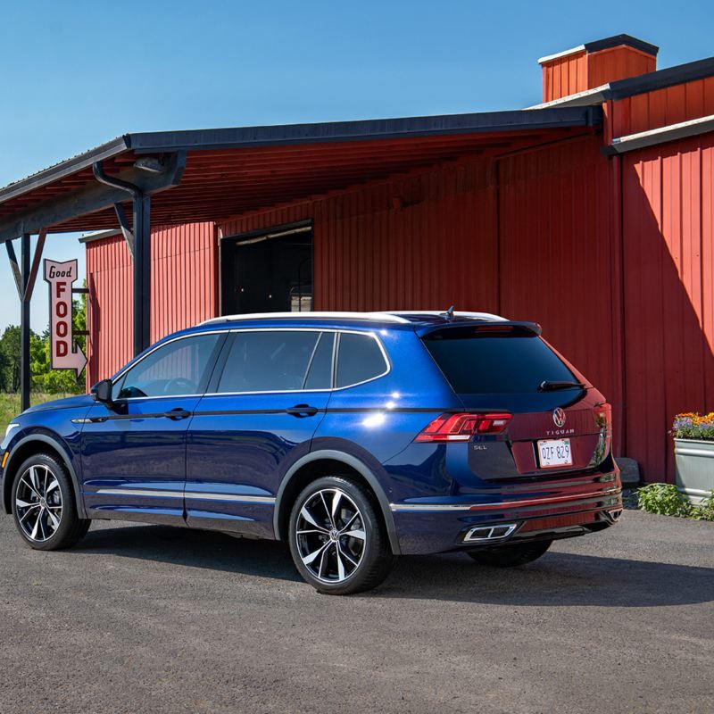 We see a blue Tiguan parked on a driveway.