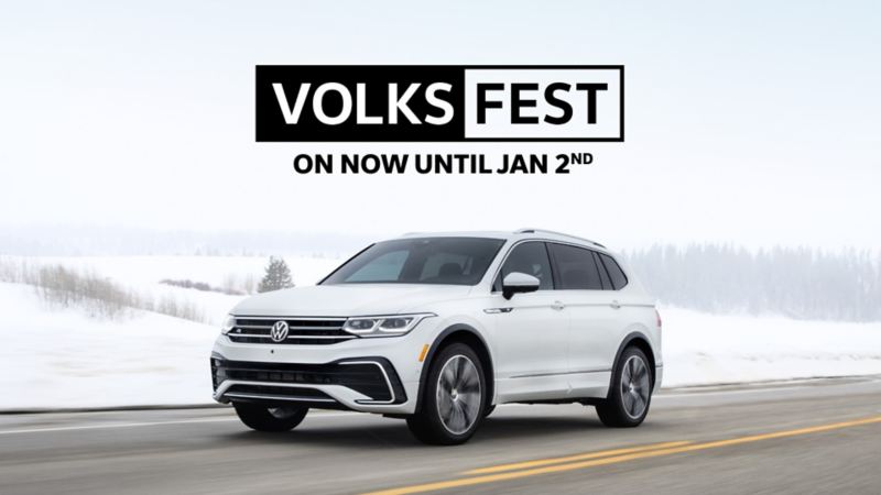 White Tiguan driving on the highway on a snow day