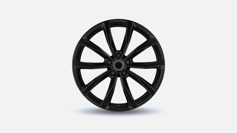 Hoogglans zwarte lichtmetalen velg met vijf dubbele spaken voor een Volkswagen Caddy.