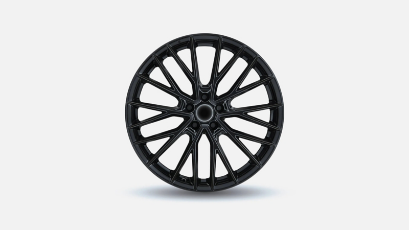 Hoogglans zwarte lichtmetalen velg met een meerspaaks design voor een Volkswagen Caddy.