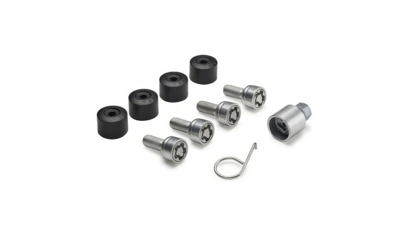 Diefstalwerende slotboutenset met vier bouten, zwarte afdekkapjes, een adaptersleutel en een verwijderhaakje.