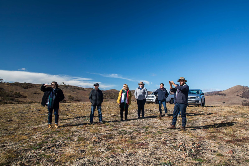 group of people stood in field