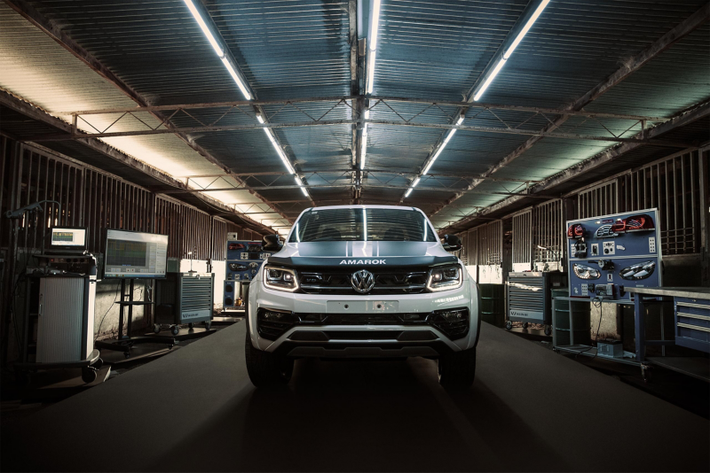 Volkswagen Amarok W-Series inside barn surrounded by tools.