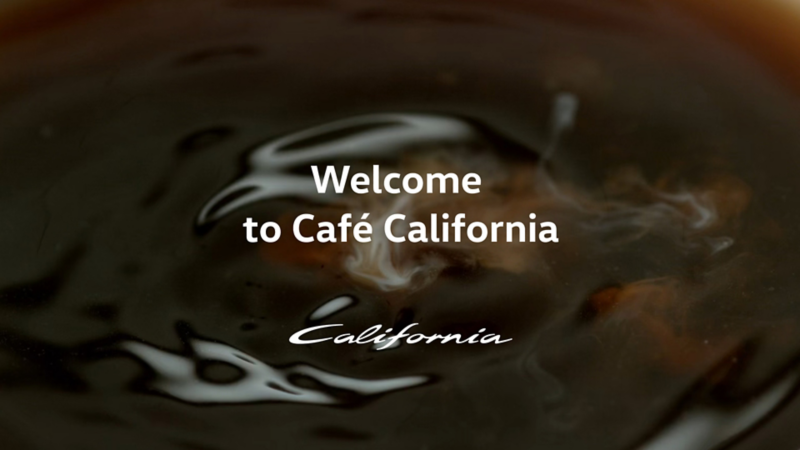 A hot black coffee in a mug.