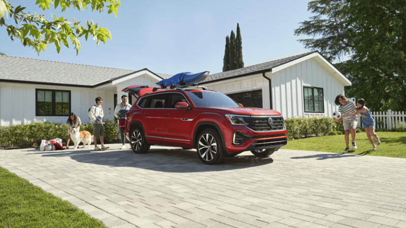 A red atlas parked in front of a home