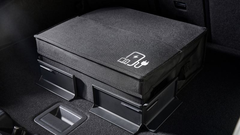 A Volkswagen Accessory Coolbox buckled on the rear seat of a VW car