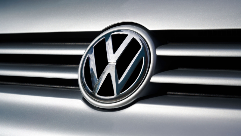 Close-up Volkswagen logo on the front of a VW car