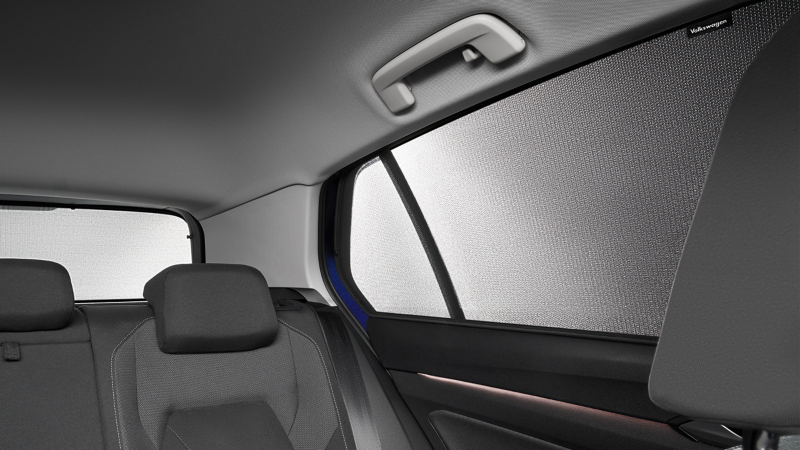 Back seat bench of VW Golf, VW Accessories sun blinds in focus