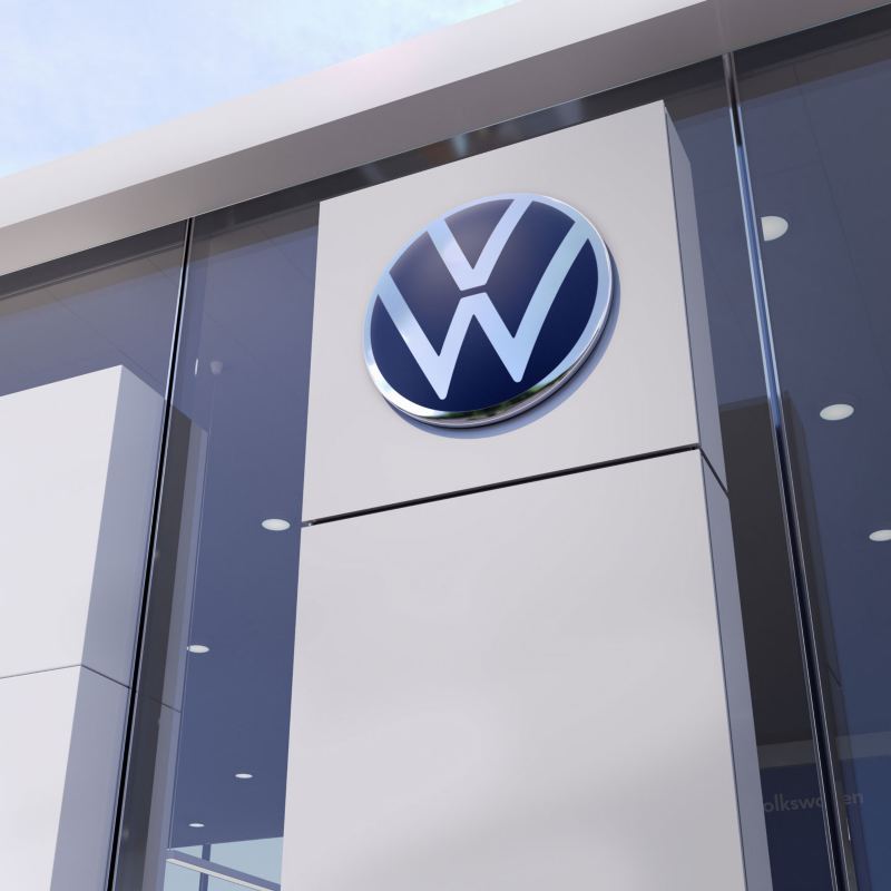 The Volkswagen logo at a Volkswagen dealership