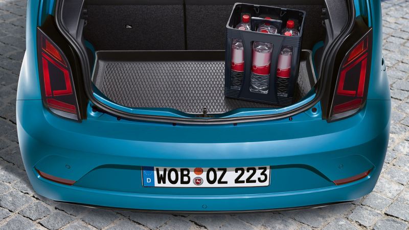 A Volkswagen car with a VW luggage compartment liner inside