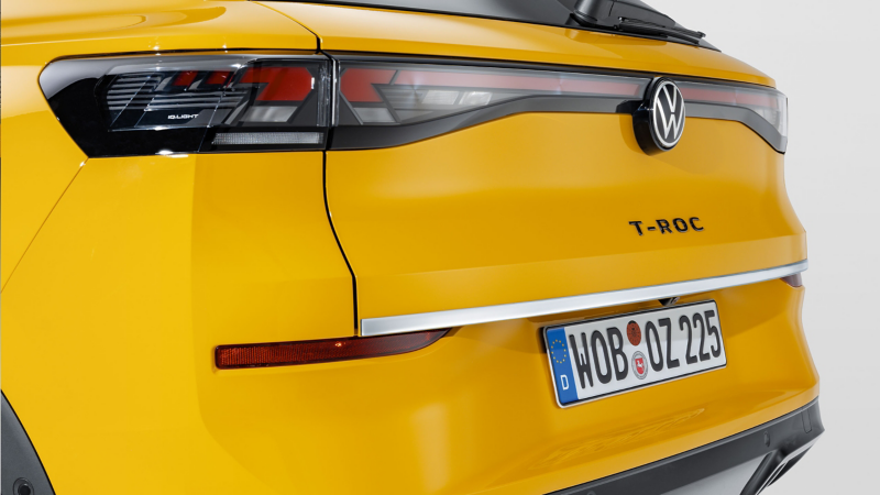 VW Accessories protective strip for the tailgate with a chrome look on a yellow T-Roc