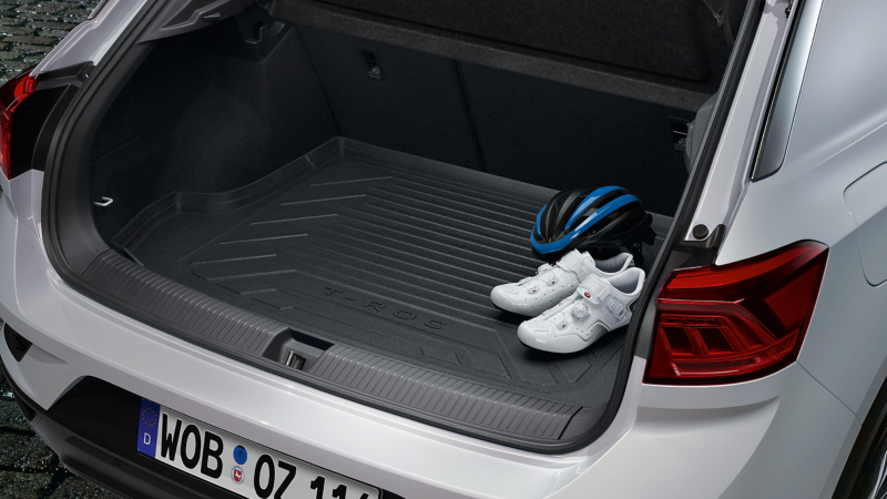 Helmet and shoes on a VW Accessories luggage compartment insert