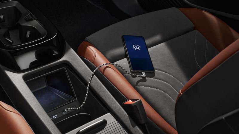 A smartphone is connected with a Volkswagen via USB premium cable