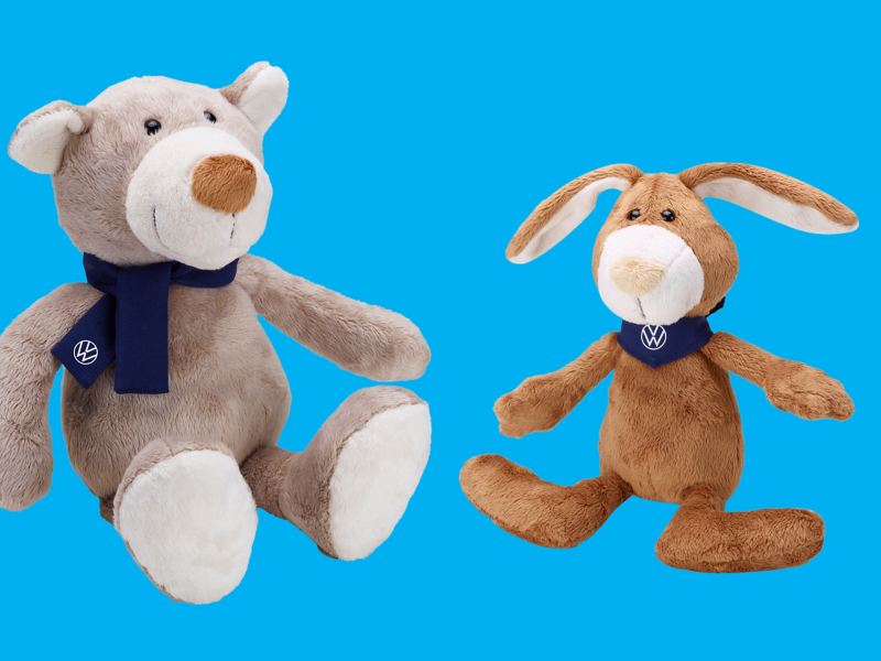 Two soft toys, rabbit and bear, with a VW scarf and VW cloth, items for children