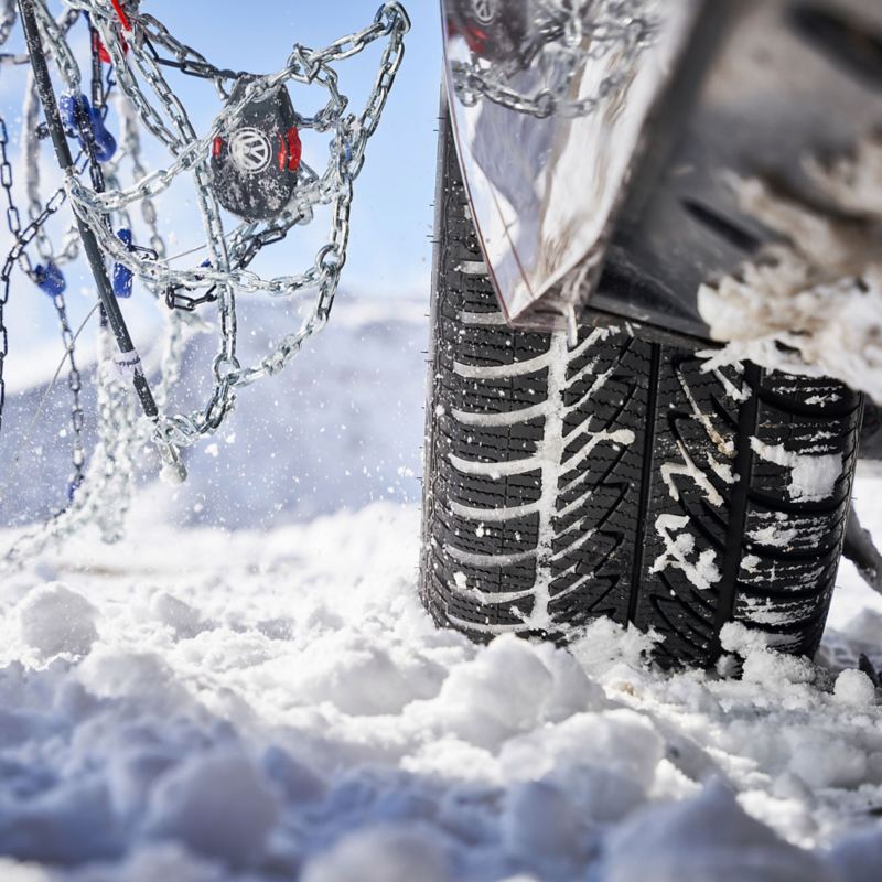 A snow chain on a VW winter tyre