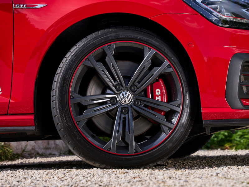 View of the wheel of a VW GTI with the brake system in focus
