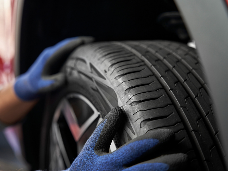 Someone checks VW tyre – Tyre Insurance