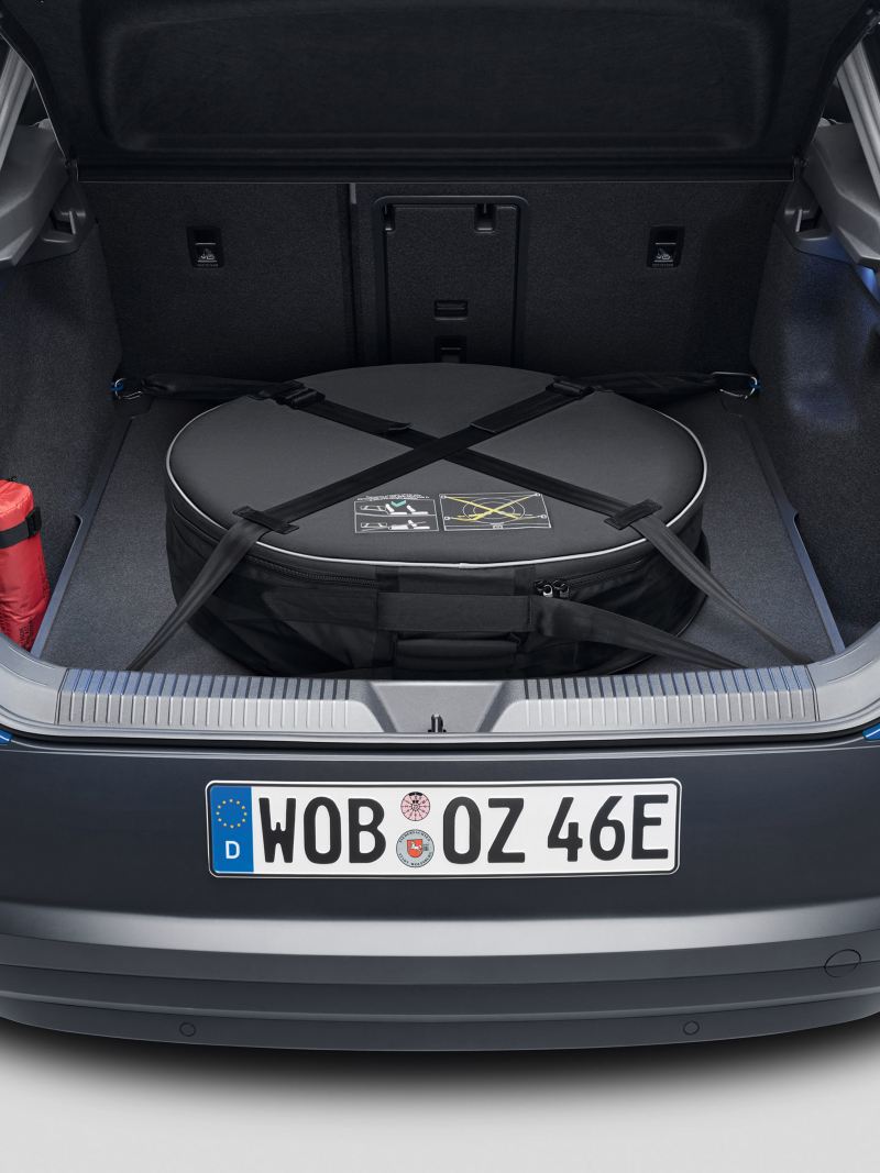 A blue VW car with open luggage compartment and folded down seat – Volkswagen luggage compartment solutions