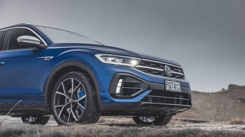 Rear view of the VW T-Roc R driving down a road