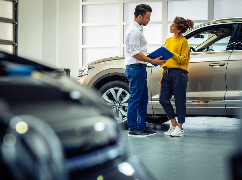Volkswagen technician assisting client