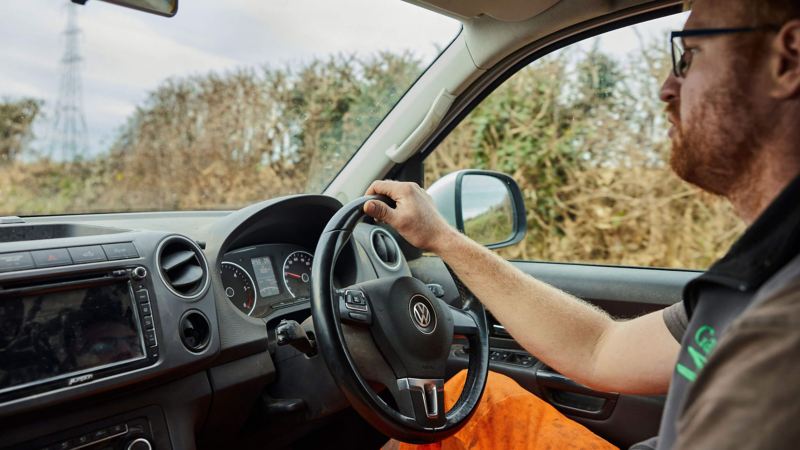 A man driving an Amarok pick-up van