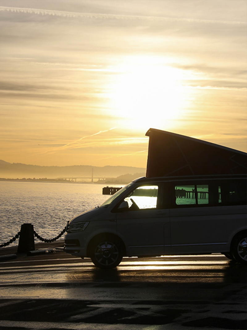 California van with roof bellow parked in the sun