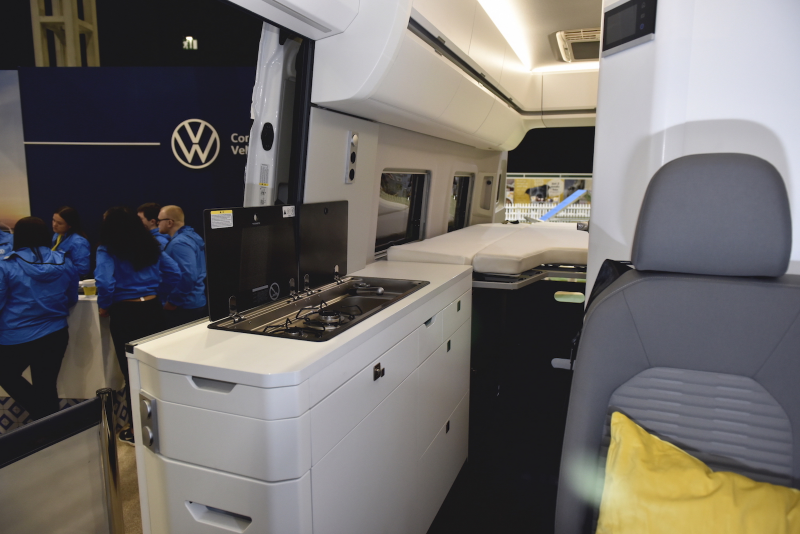 Photo showing the interior kitchen section of a VW camper van. 