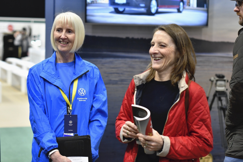 A member of the public interacting with a VW representative at the CCM show. 