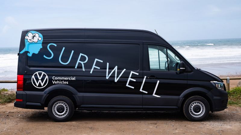 A photo of a Surfwell branded VW van.