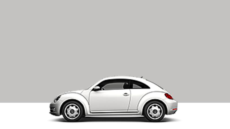 Side view of a VW Beetle on a grey background