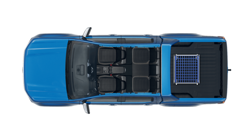 VW Amarok Aventura lastad med rullcontainer.