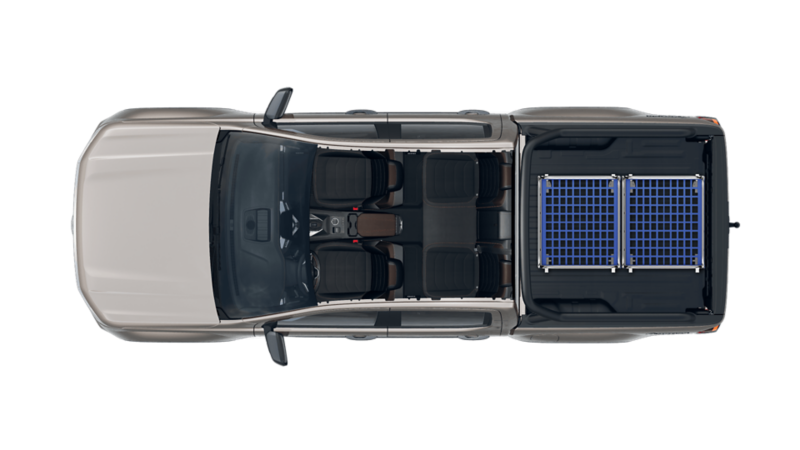 VW Amarok PanAmericana lastad med rullcontainer.