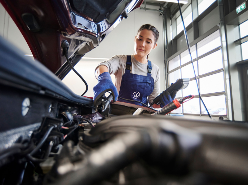 a Volkswagen engineer testing a EV battery