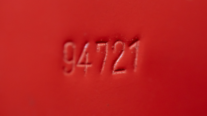 Photo showing a closeup of the body number stamp on a VW Samba van. 