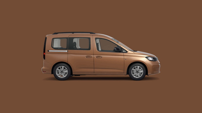 A VW Caddy against a plain brown background. 