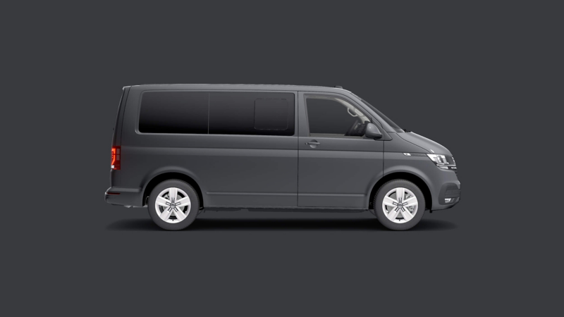 A VW Transporter kombi against a plain grey background. 